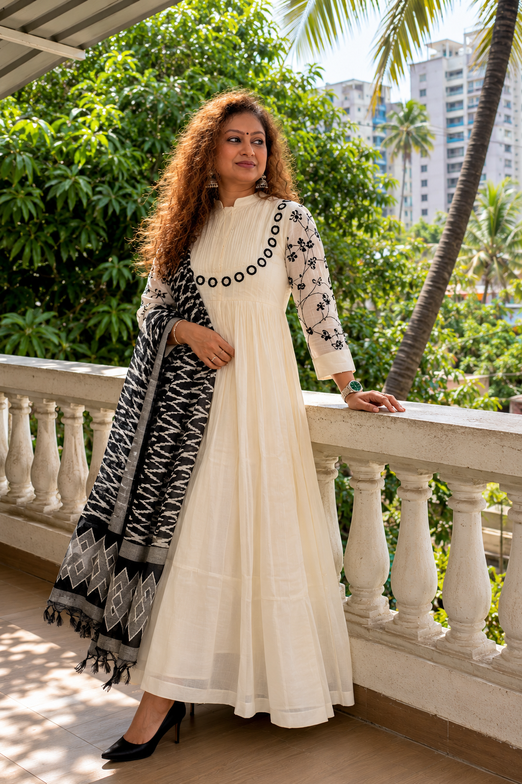 Woman wearing Saanjh ivory Chanderi Anarkali with mirrorwork yoke by Nayab Pitara – how to choose an Anarkali suit set