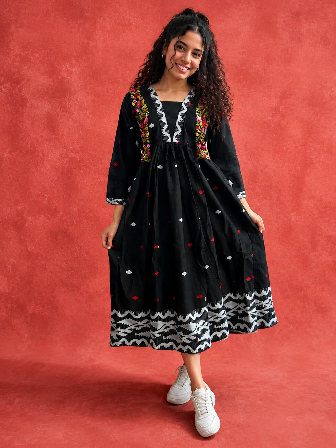 Woman wearing Rangmala black Jamdani cotton dress with multicoloured floral embroidery by Nayab Pitara