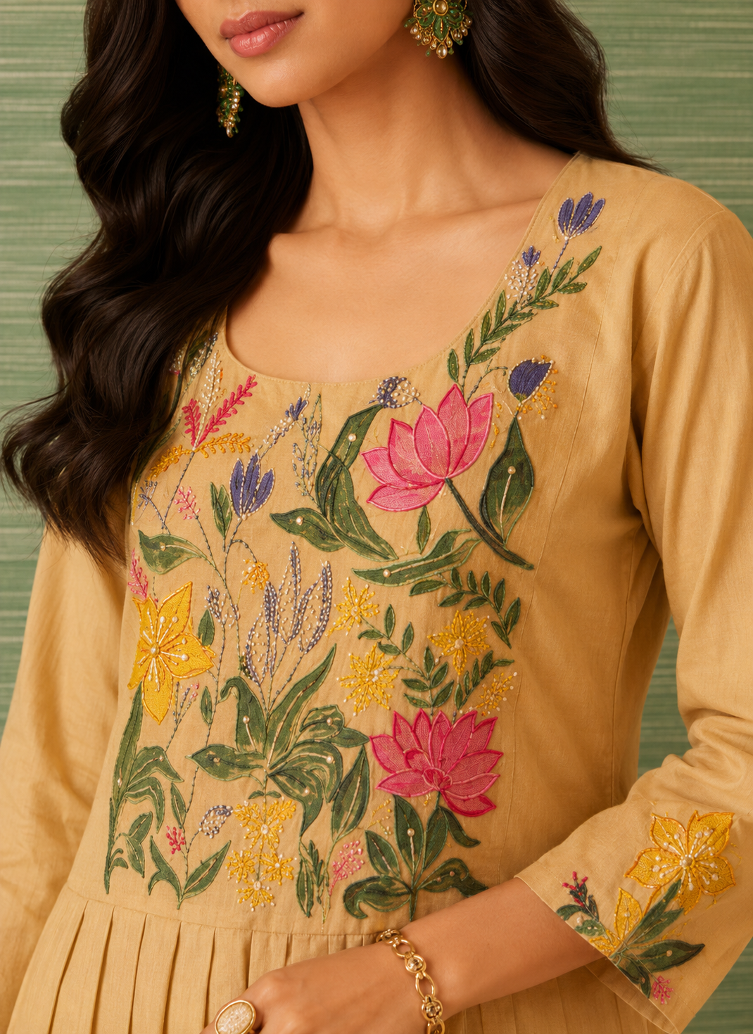Woman wearing Mehek beige cotton A-line midi dress with floral hand embroidery on the yoke by Nayab Pitara