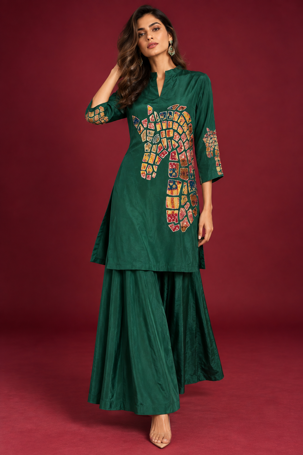 Woman wearing Tasva emerald green festive kurta co-ord set with multicoloured mosaic artwork by Nayab Pitara
