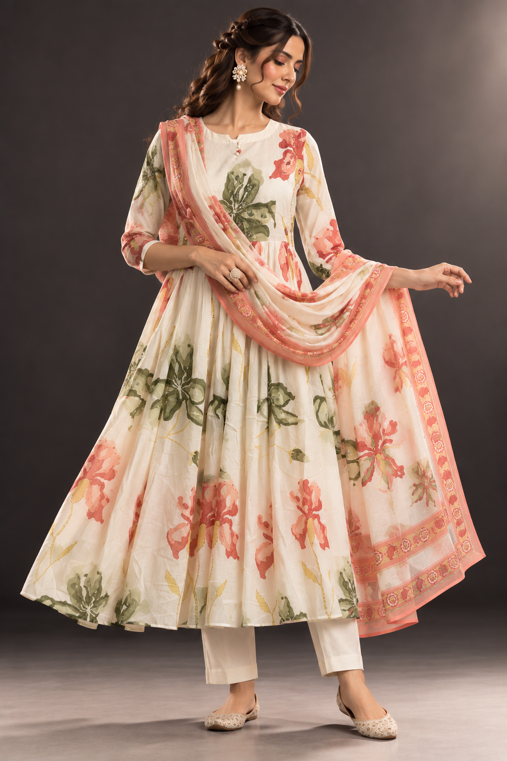 Woman wearing Saumya ivory floral mul cotton anarkali suit set with floral dupatta by Nayab Pitara