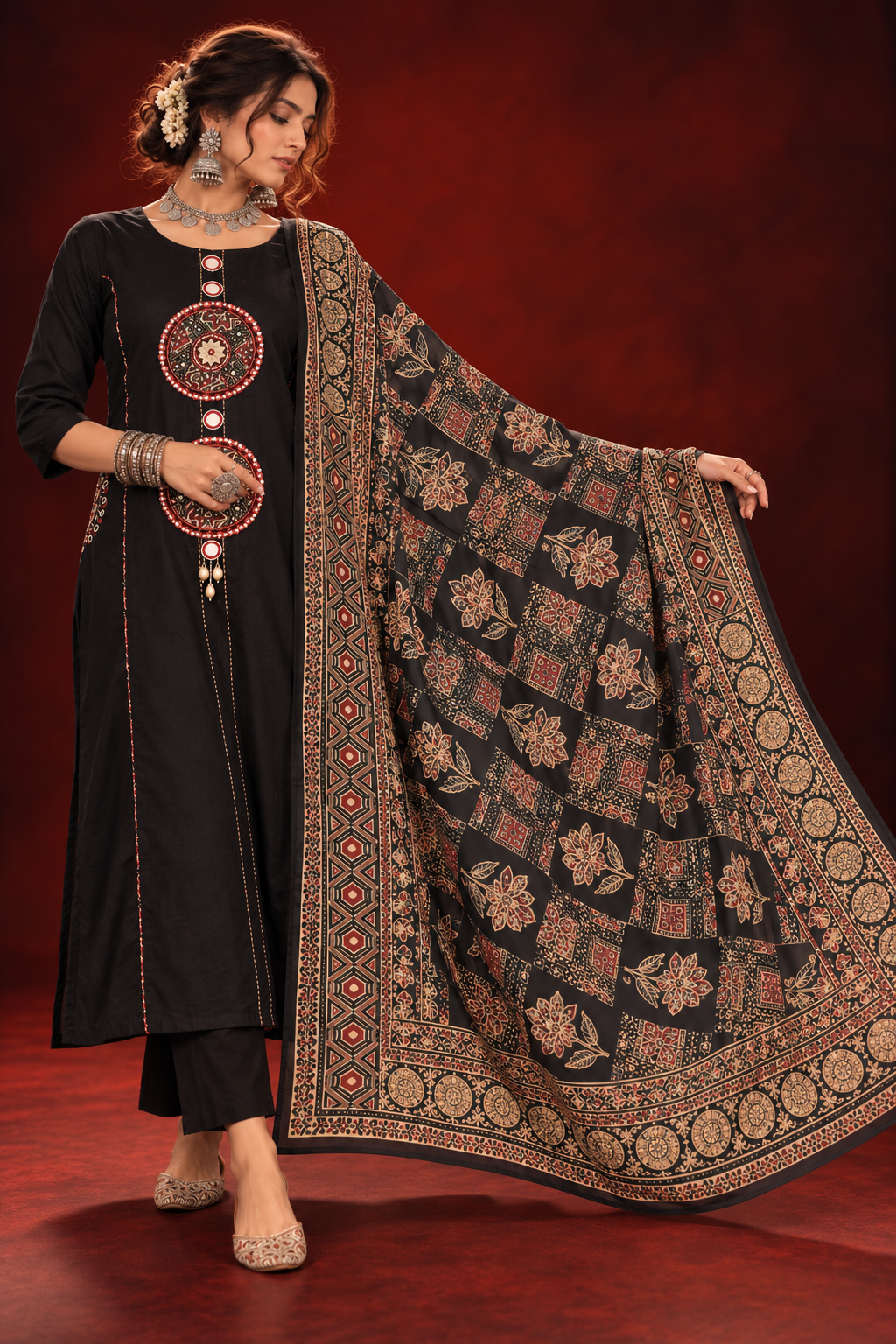 Woman wearing Zohra black cotton anarkali suit set with embroidered yoke and printed dupatta by Nayab Pitara